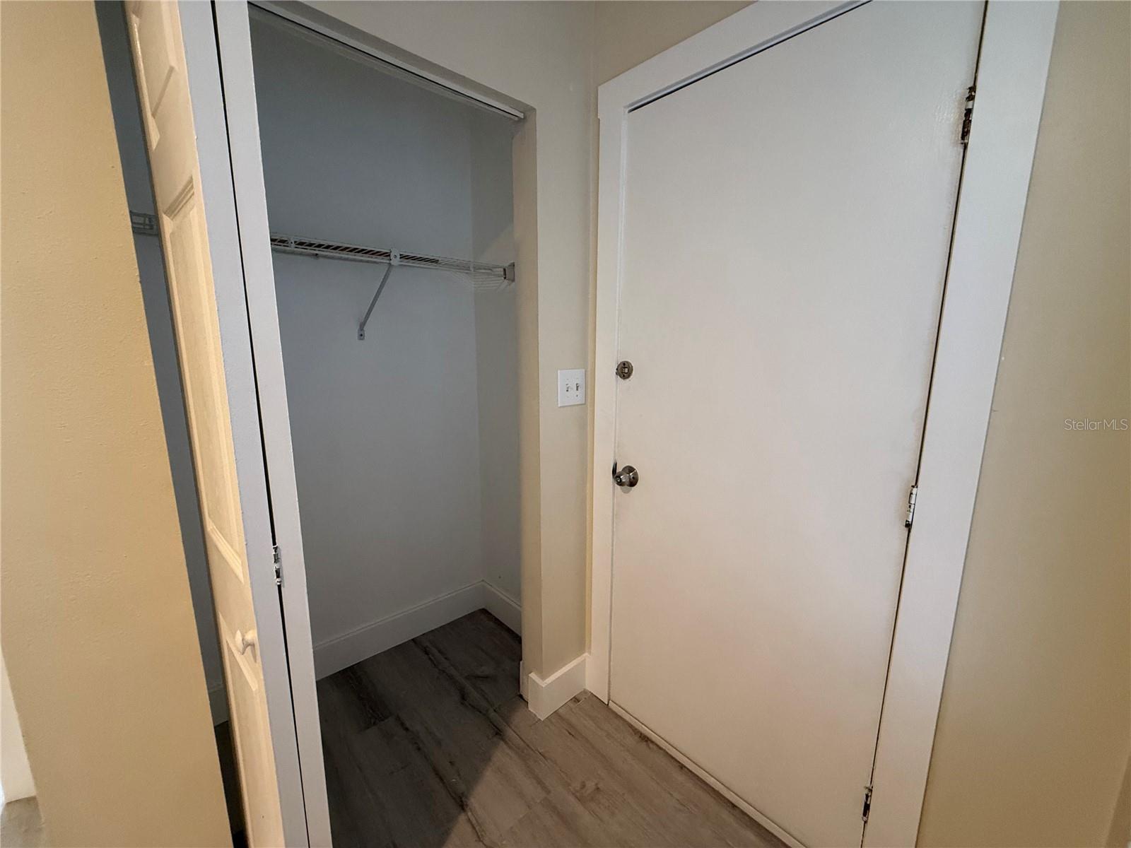 Downstairs entrance to garage & closet