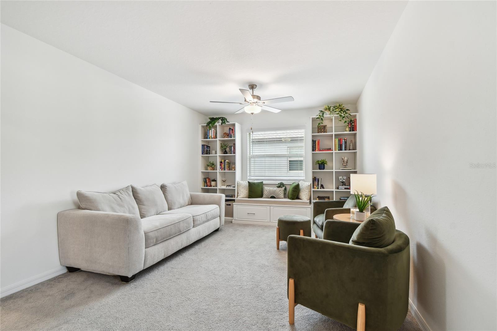 Loft area with built in shelves and bench