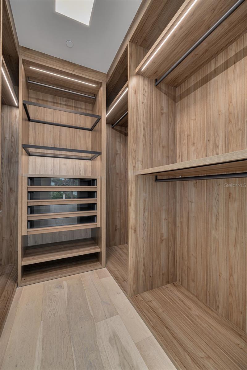 Primary bedroom walk-in closet
