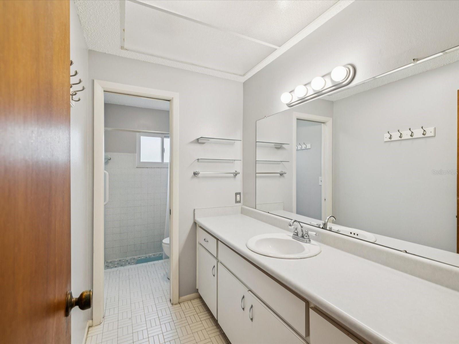 Sink and vanity area separate from shower to make getting ready a breeze!