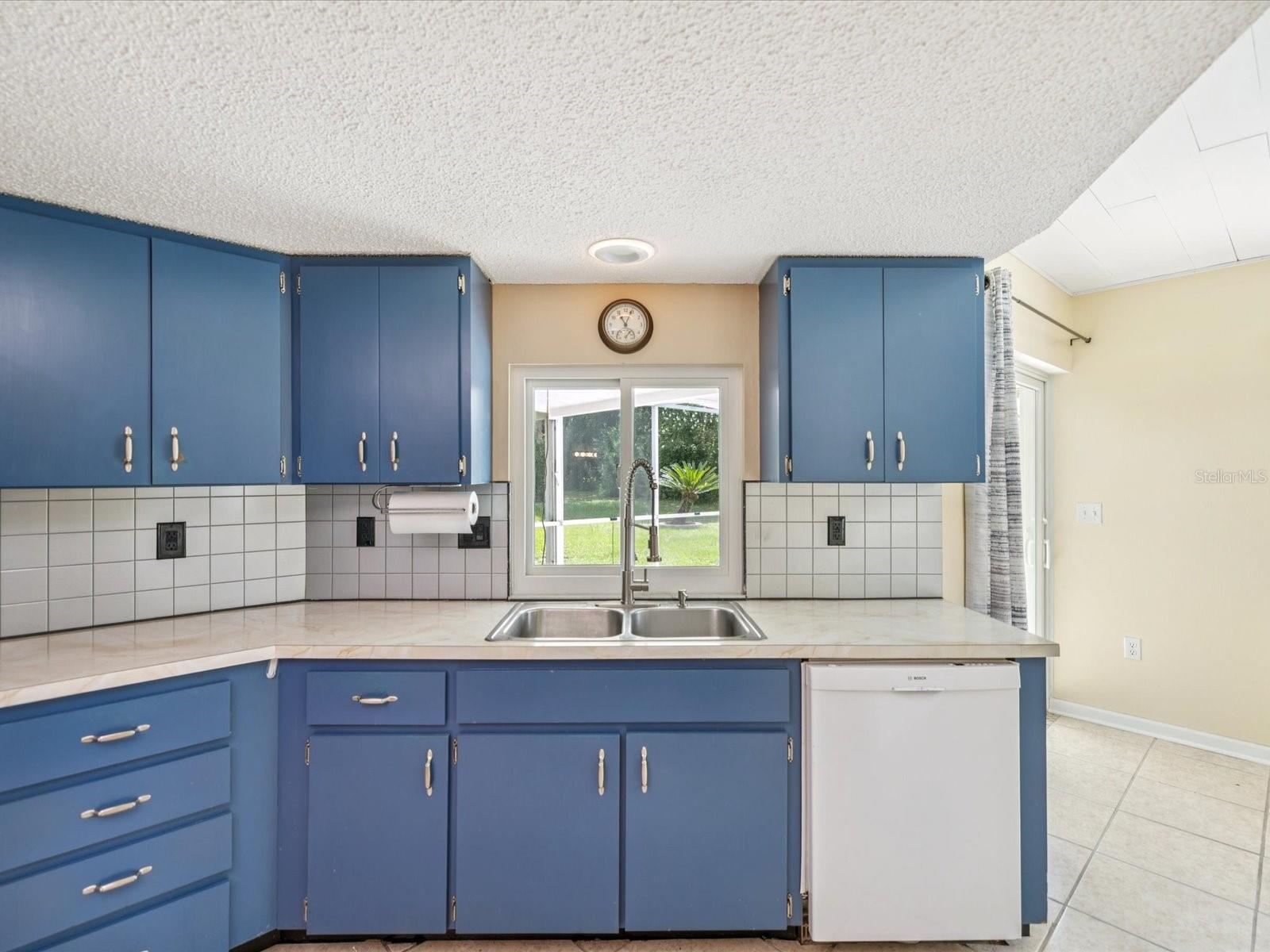 Dinners on the back patio are easy with this pass-through window connected to the kitchen!