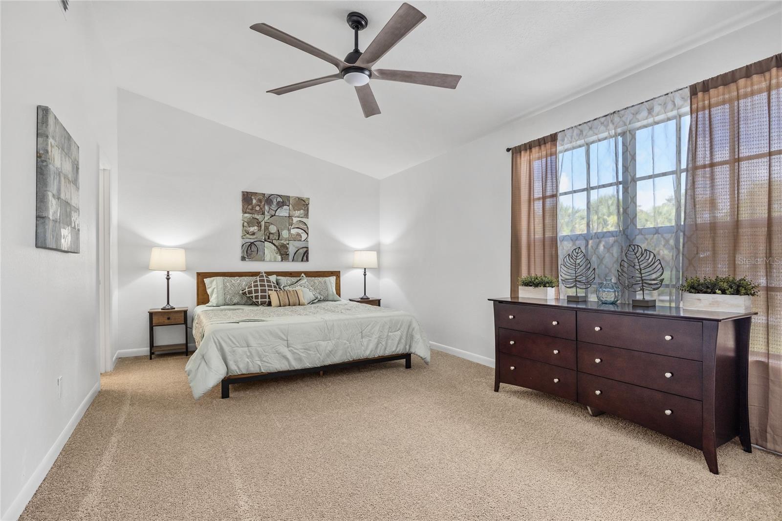 The Primary Bedroom is MASSIVE with two large walk in closets and a private en suite bathroom.