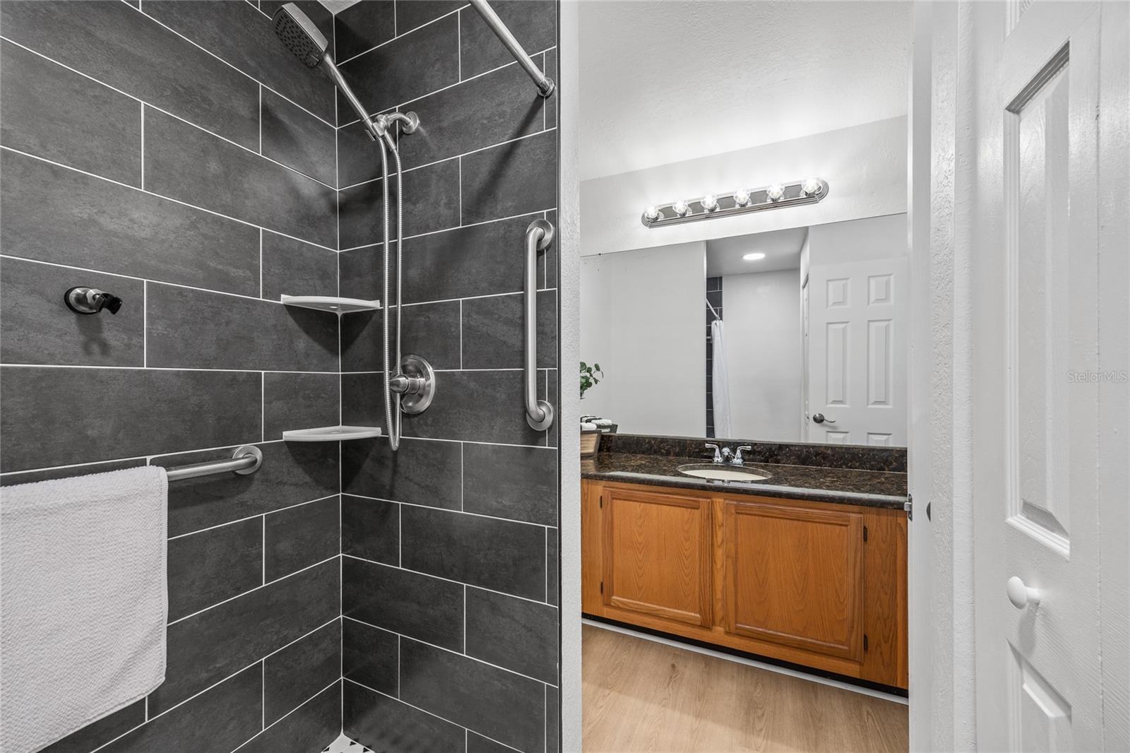 Luxury vinyl flooring and a full tile shower complete this Primary Bathroom.