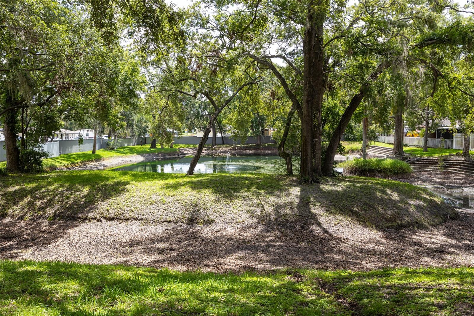 There is also a tranquil pond near the pool area.
