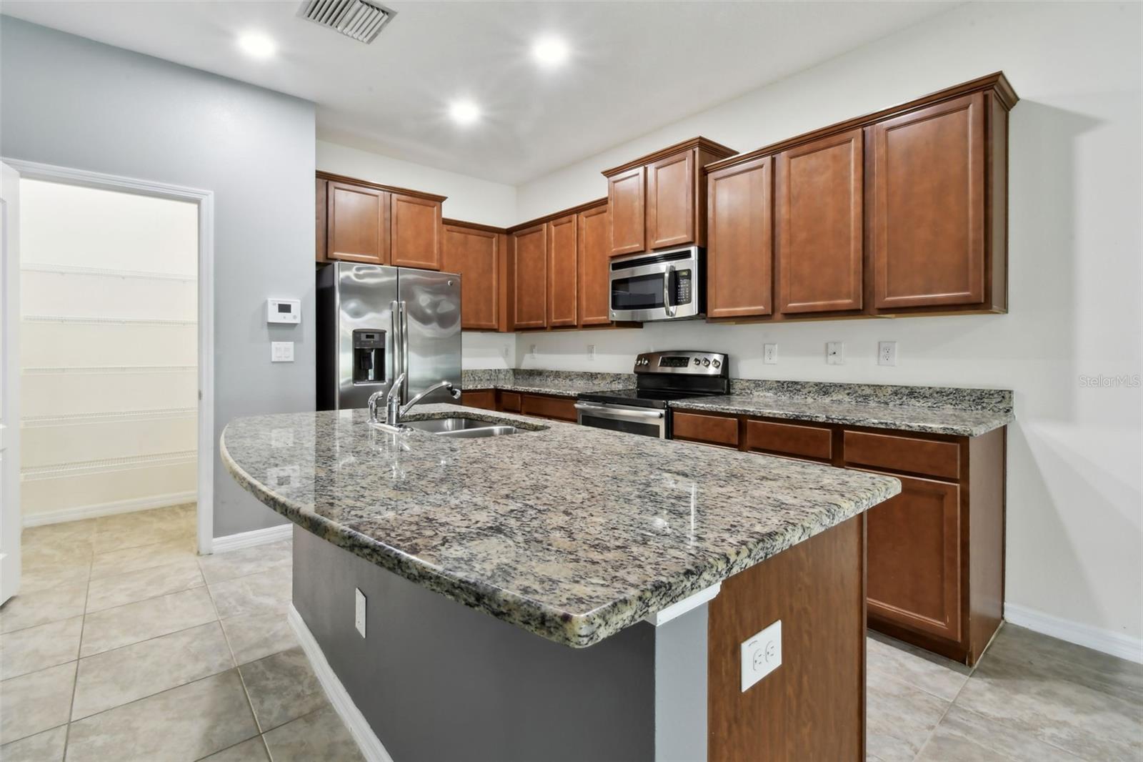 Kitchen with view into pantry