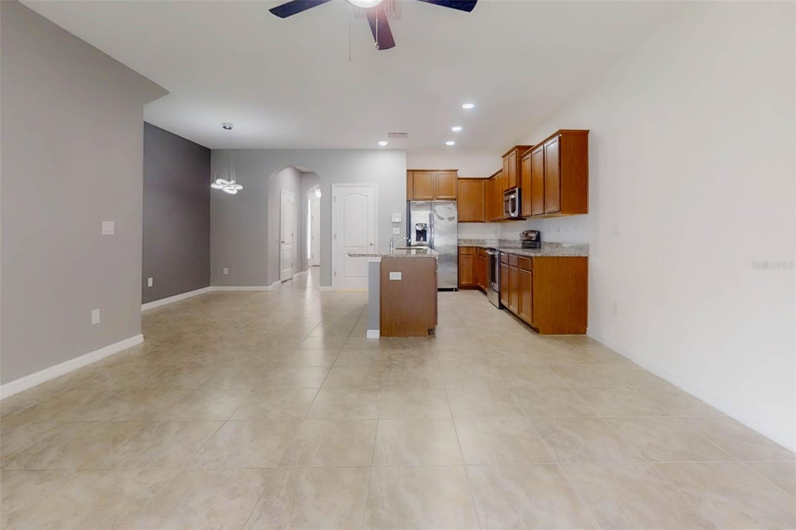 Living room with view toward kitchen