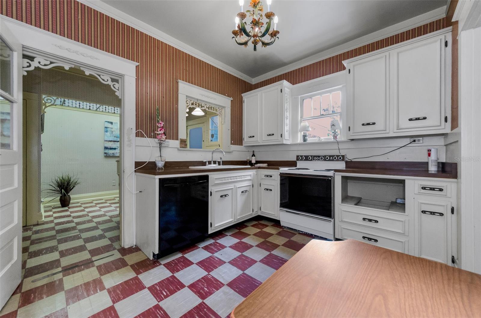 original checkerboard flooring adds vintage flair & 1920s drama