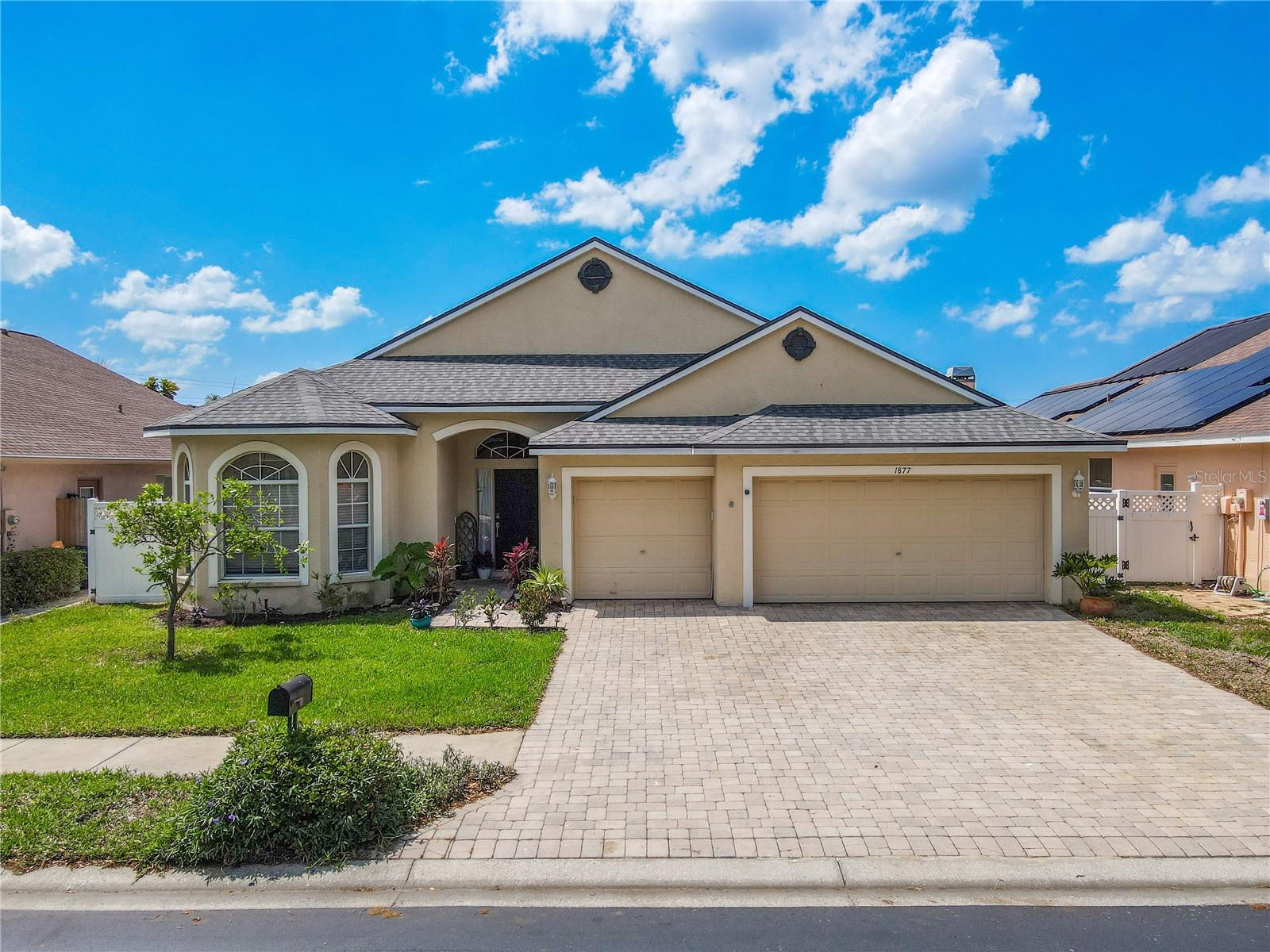 Immaculately maintained, 4 Bedroom 2 bath, 3 car garage, Screened in pool home in gated Forest Ridge in Tarpon Springs.