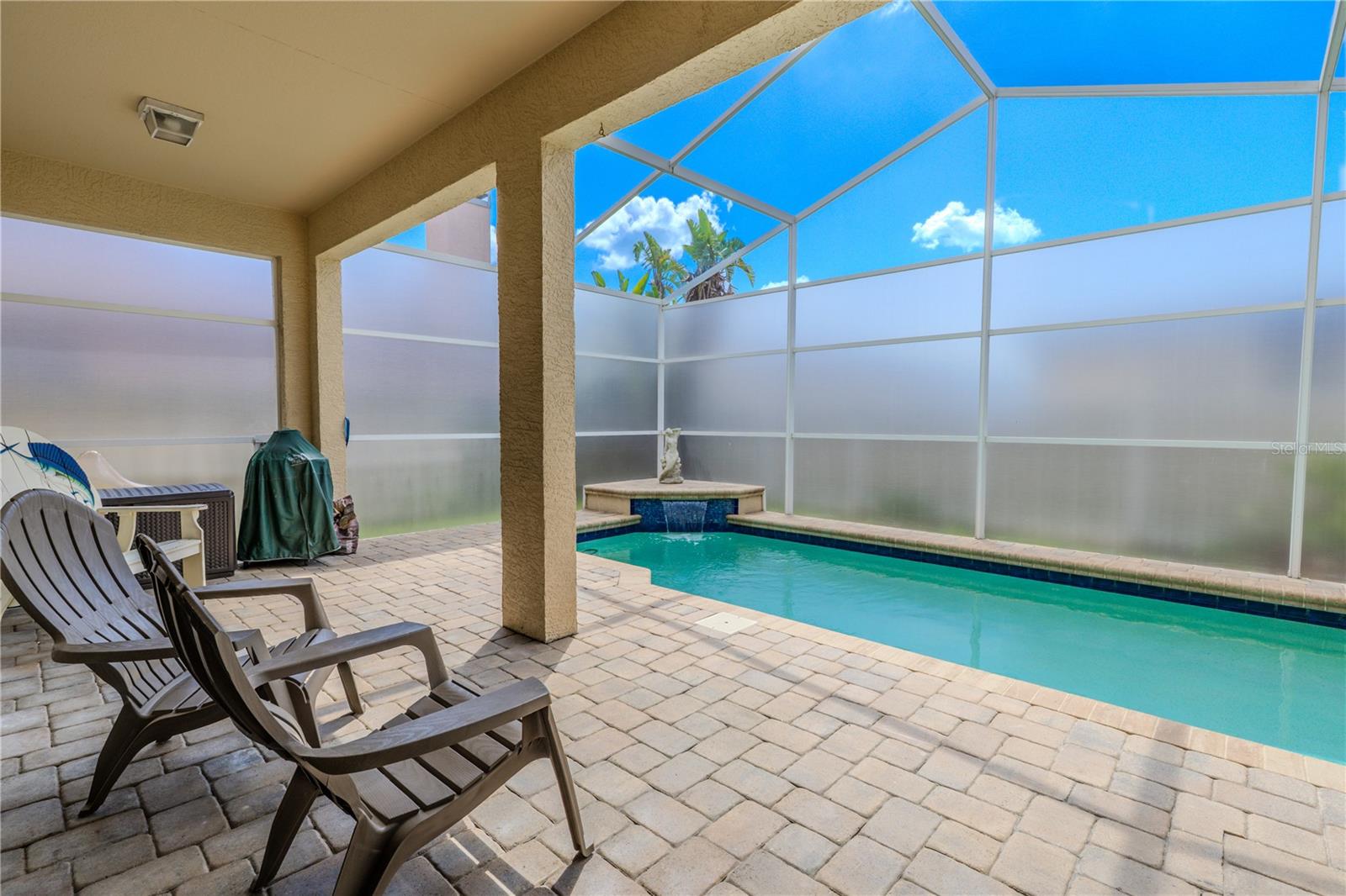 Step outside to your screened-in lanai—your own private oasis.