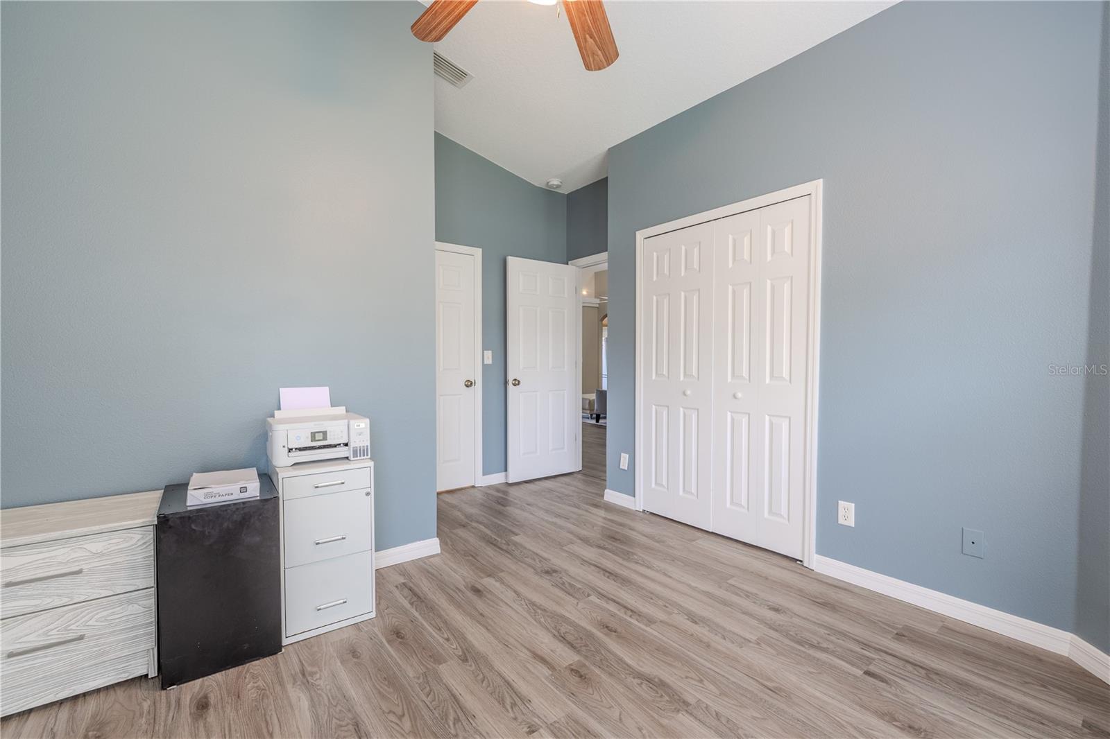 With high ceilings, vinyl flooring, and a built-in closet, it’s the kind of space that instantly feels special—whether used for work, guests, or play.
