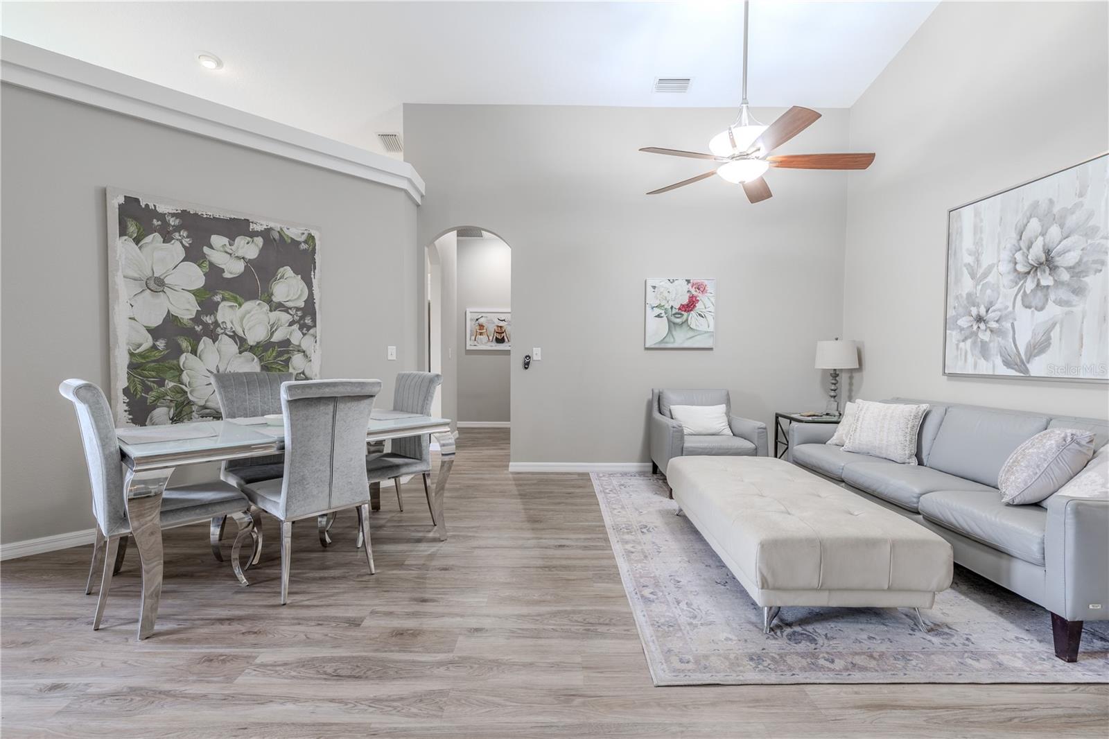 High ceilings and architectural details in the dining and living rooms create a grand yet inviting atmosphere, perfect for both everyday living and elegant entertaining.