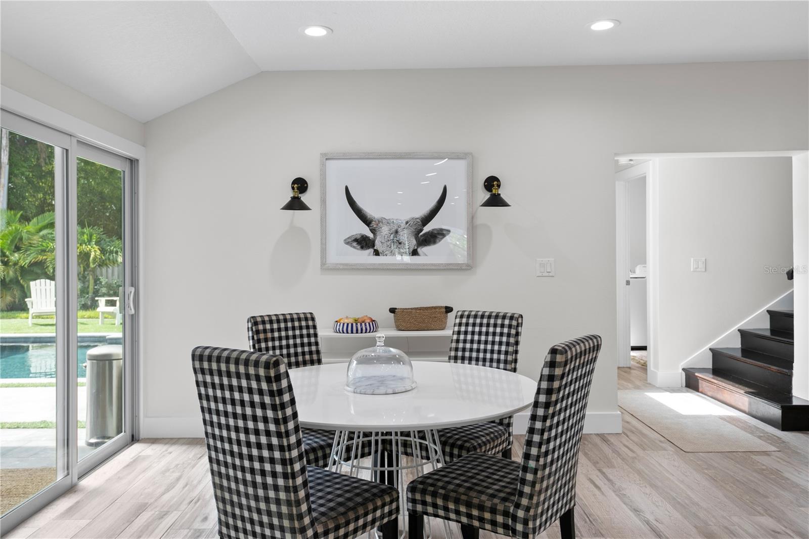 Step through the sliding glass doors just off the Kitchen into your private Backyard Oasis.