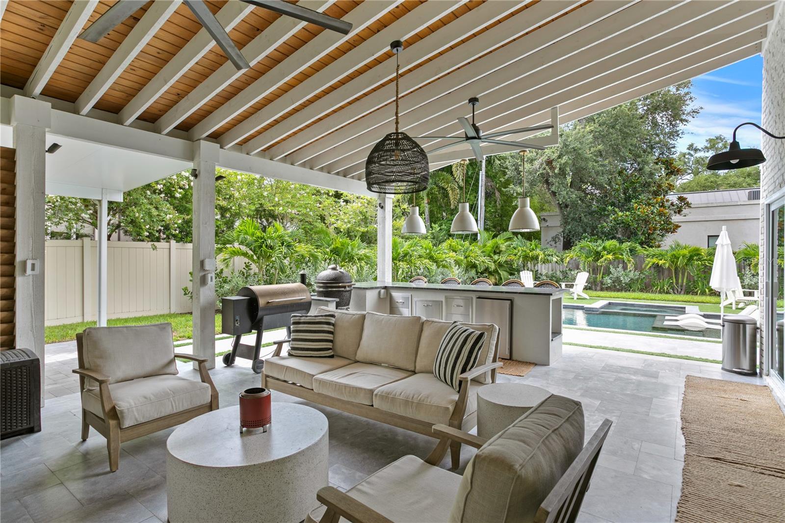 A spacious covered patio featuring a full outdoor kitchen — an entertainer’sdream come true.