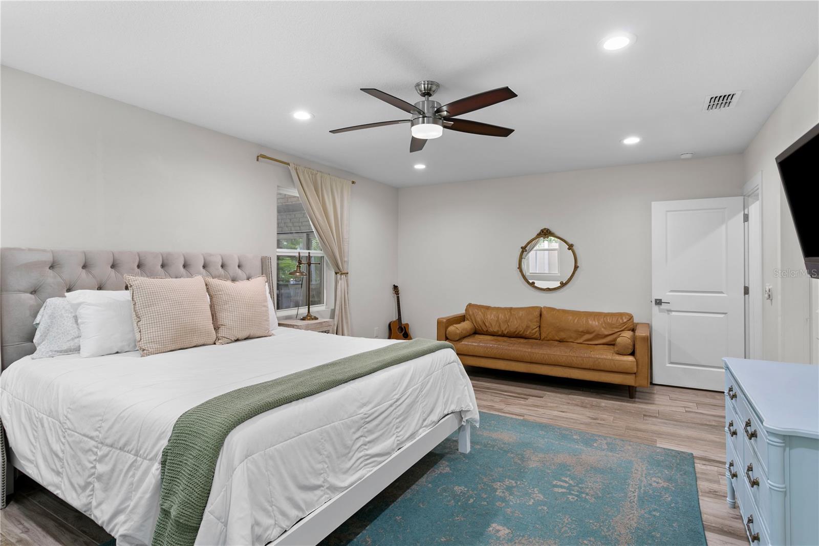 The first floor primary suite offers ultimate flexibility