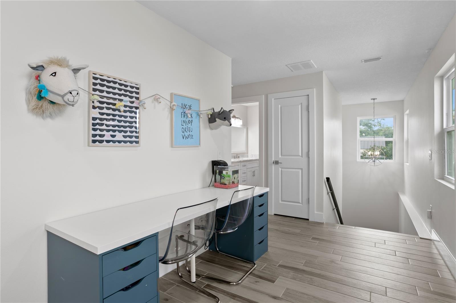 Landing at top of the stairs offers versatile flex space.