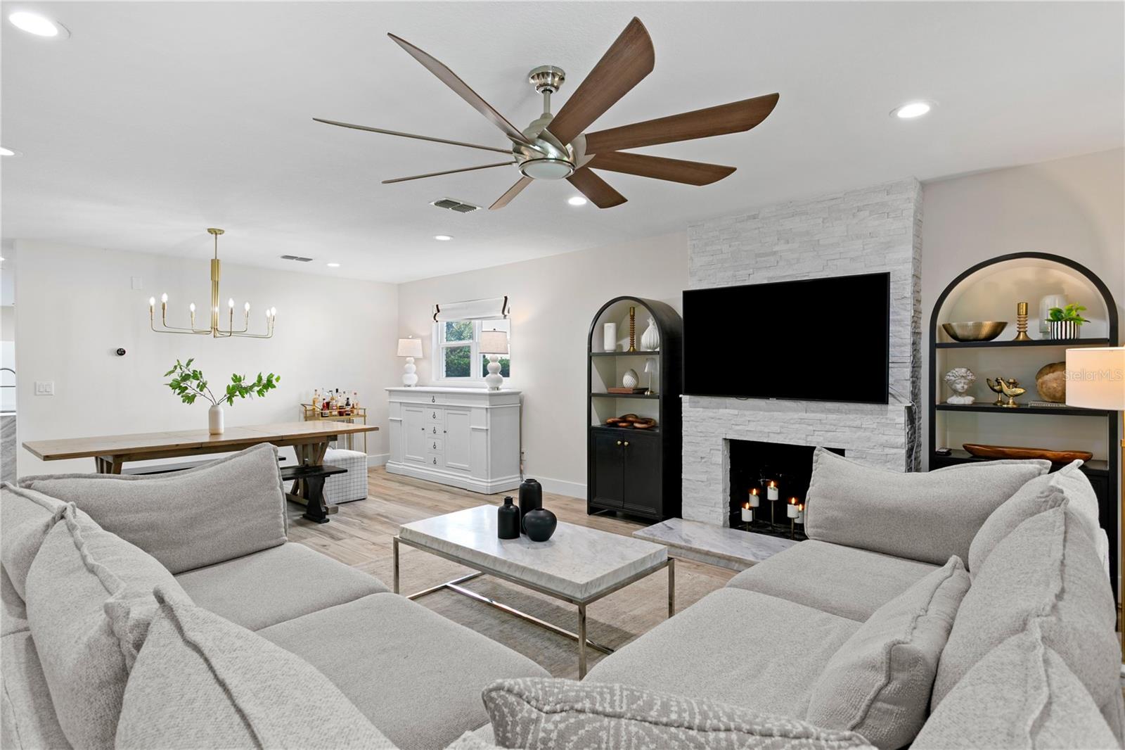 Natural light pours through every corner of the open-concept floor plan.