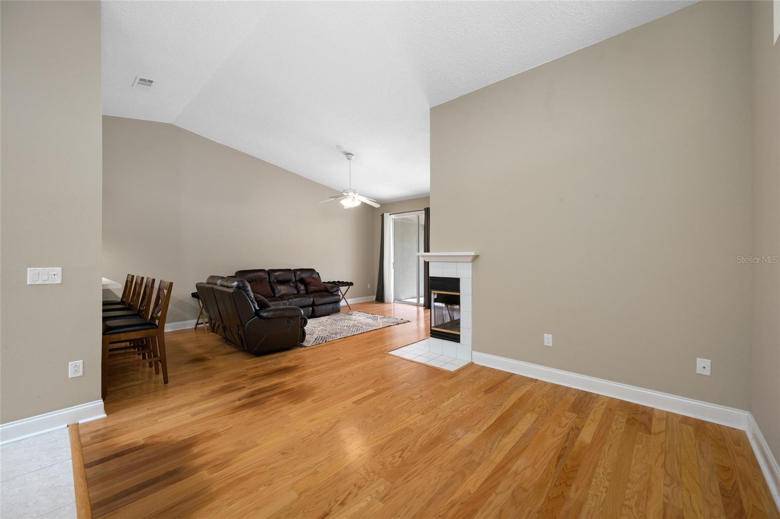 Bright & Airy Living Room — Experience Comfortable, Open Living at 3005 Pepperwood Ln W with Soaring Ceilings and Natural Light.