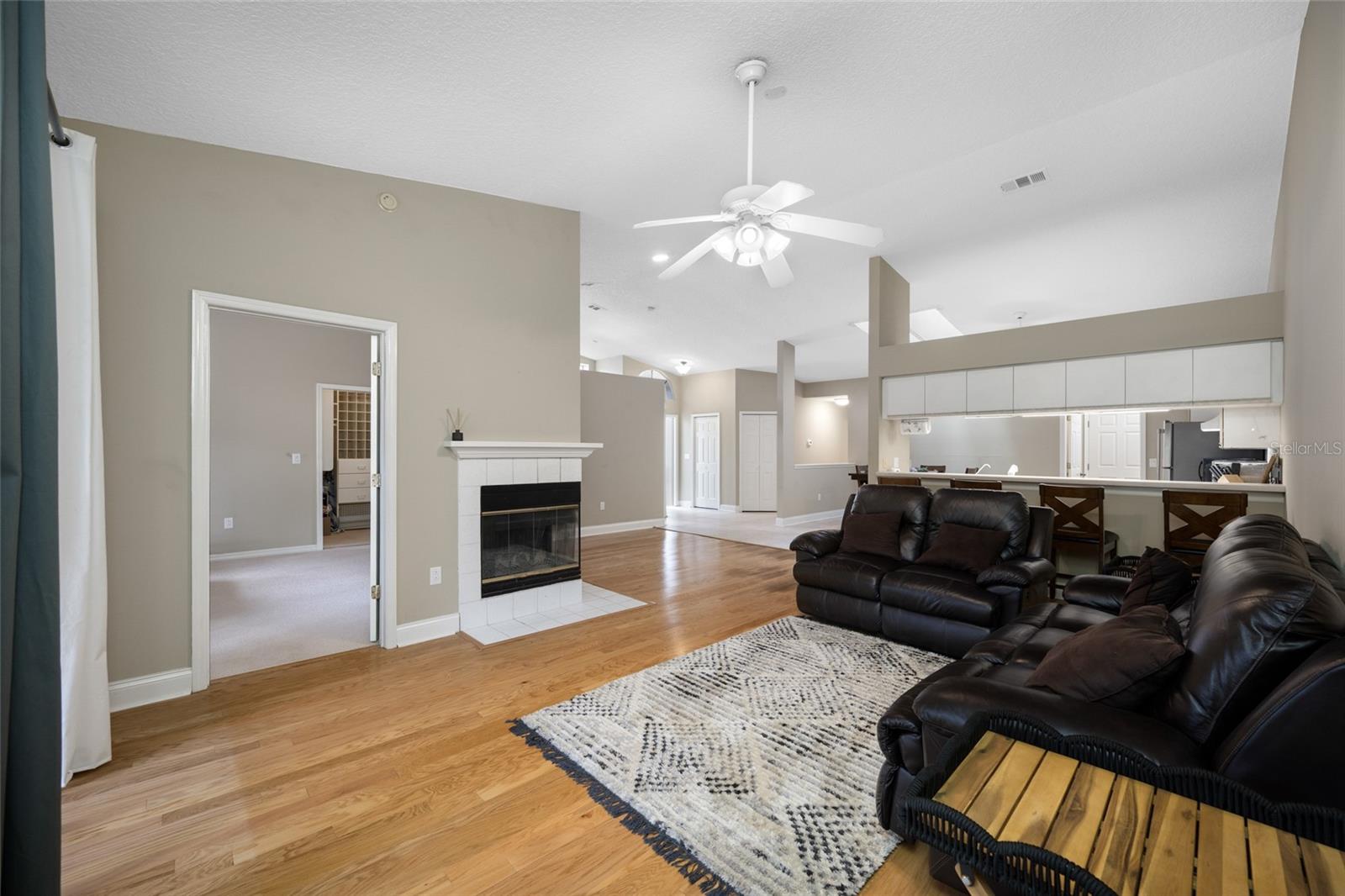 Spacious Living Room Retreat — 3005 Pepperwood Ln W Offers an Open, Light-Filled Living Area with Fireplace Focal Point, Perfect for Everyday Comfort and Entertaining.