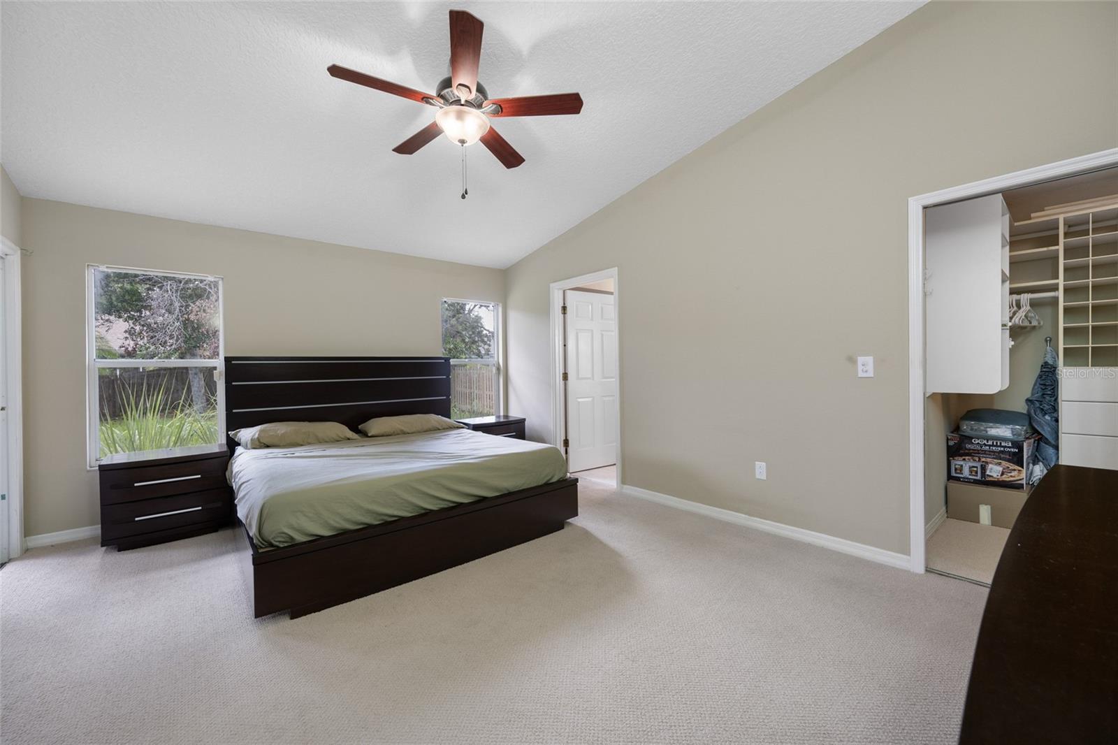 Serene Primary Suite — 3005 Pepperwood Ln W Features a Spacious Primary Bedroom with Soft Natural Light and Relaxing Ambiance.