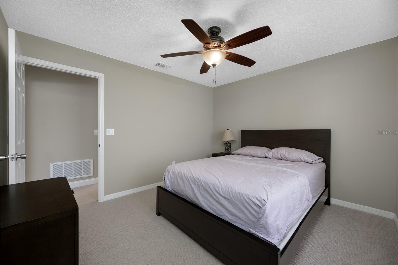 Versatile Second Bedroom — Create a Cozy Guest Space, Home Office, or Hobby Room in the Well-Sized Second Bedroom at 3005 Pepperwood Ln W.