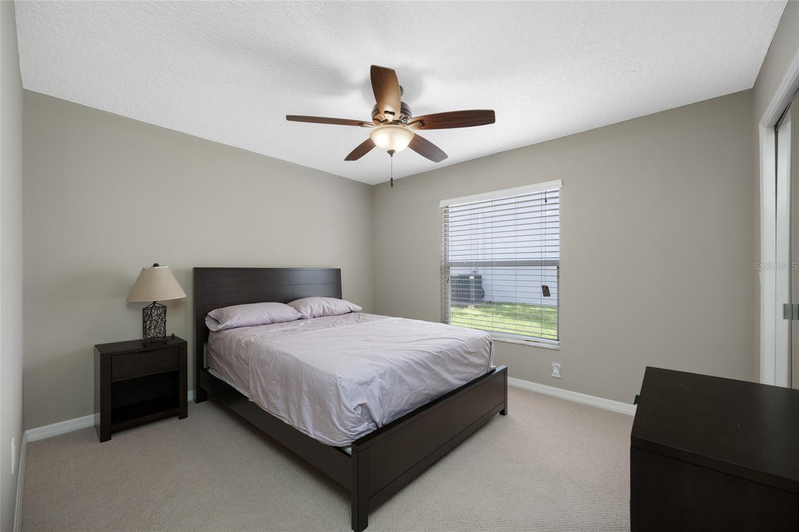 Comfortable Second Bedroom — 3005 Pepperwood Ln W Offers a Bright and Spacious Guest Room, Perfect for Family or Visitors.