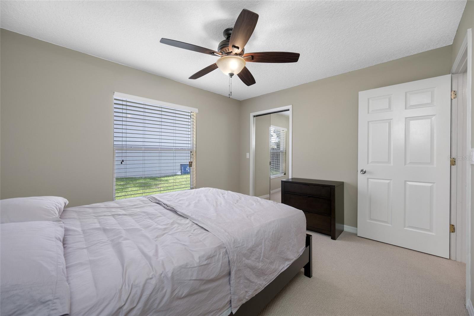 Inviting Guest Room — The Second Bedroom at 3005 Pepperwood Ln W Provides a Quiet, Comfortable Space for Overnight Guests or Everyday Use.