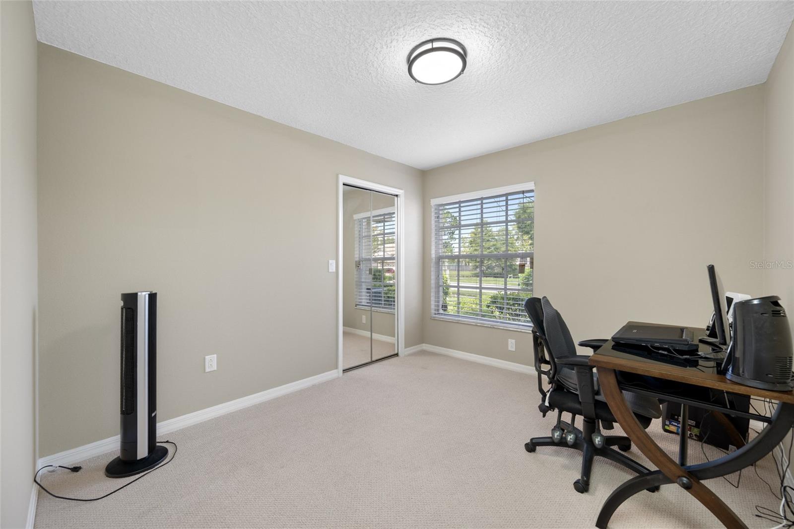 Flexible Third Bedroom — 3005 Pepperwood Ln W Offers a Spacious Third Bedroom Ideal for Guests, a Home Office, or Creative Space.