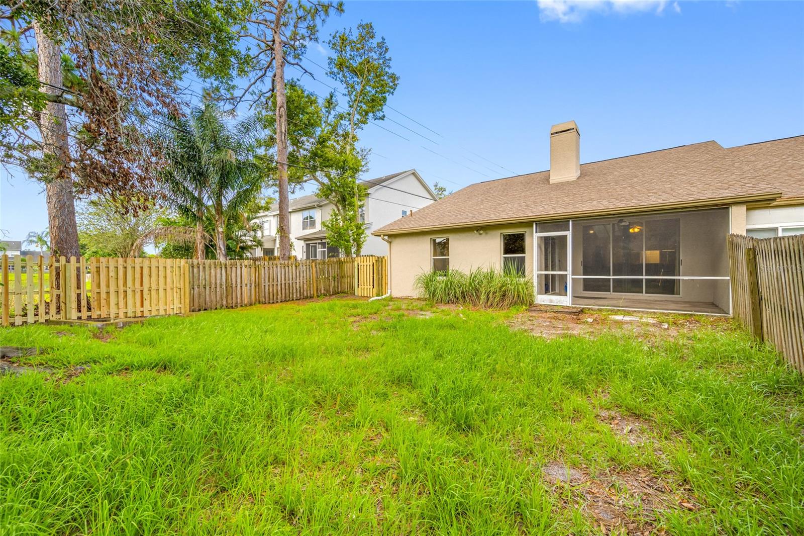 Spacious Fenced Yard — 3005 Pepperwood Ln W Offers a Rare Clearwater Villa Feature: Expansive, Private Outdoor Space Ideal for Gatherings, Gardening, or Play