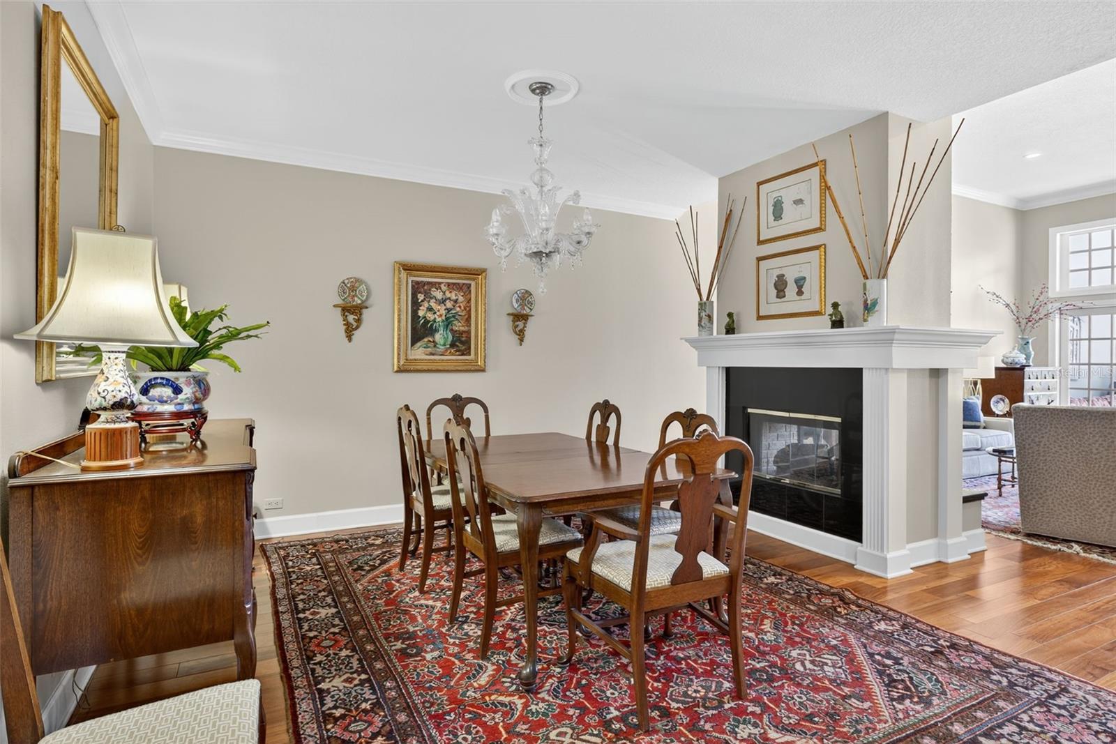 Formal Dining room with two-sided gas fireplace to living room