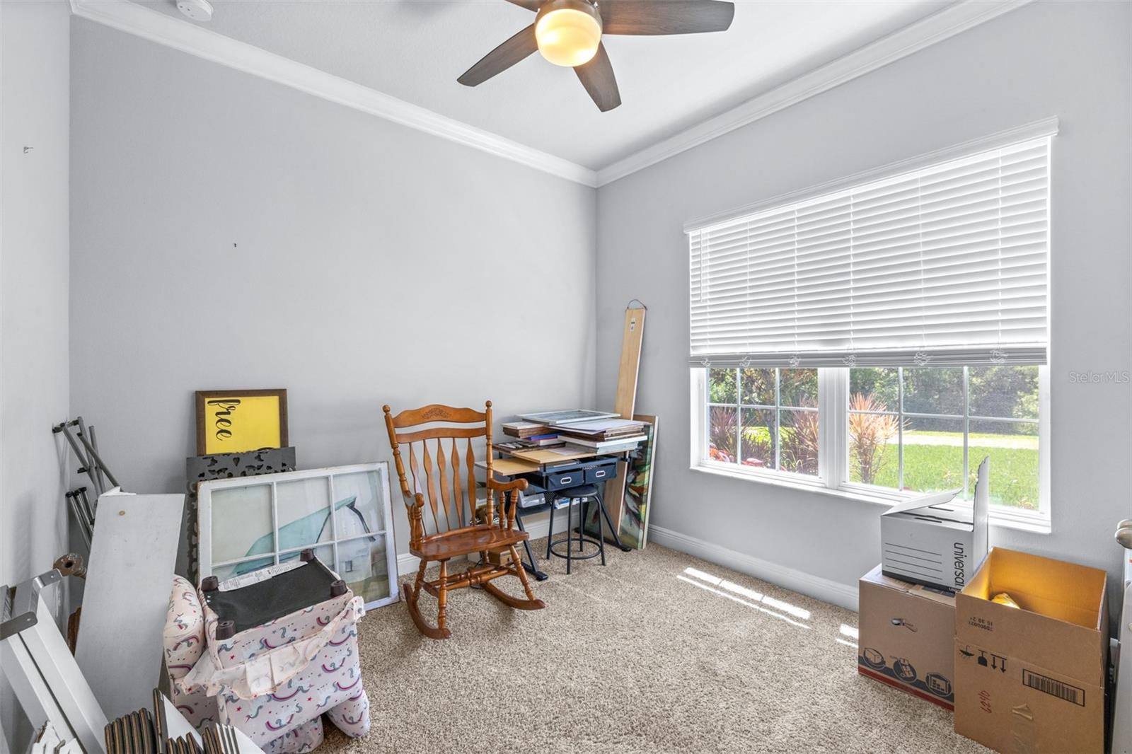 guest bedroom in the front of the home with closet not shown.  Currently being used as a packing station for the move!