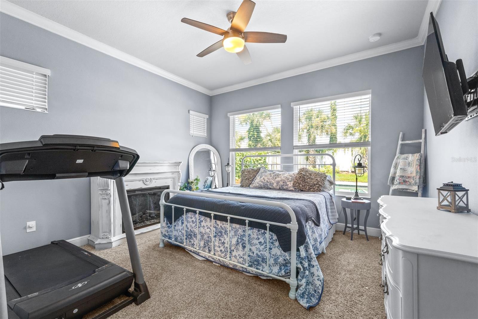 primary bedroom downstairs with backyard views.  Fireplace is not a built in, it is a piece of furniture so it does not convey