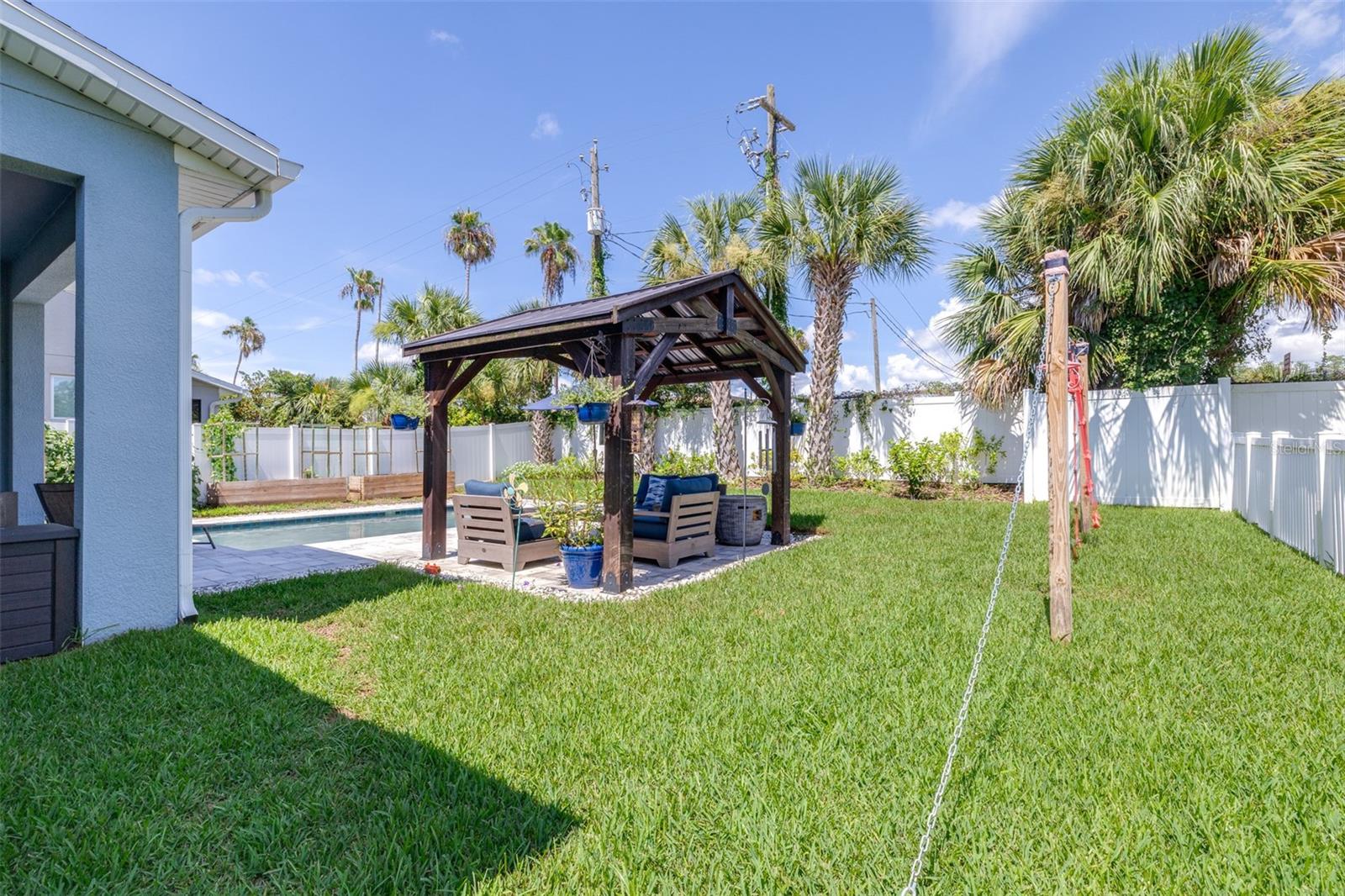 backyard is fully fenced and comes with planter boxes