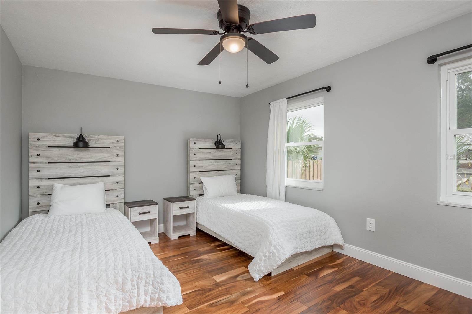 3rd bedroom with two built in closets, ceiling fan.