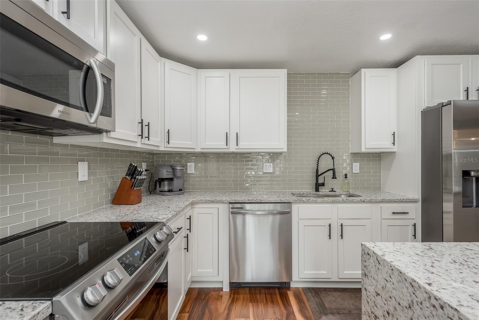 Nicely updated kitchen with granite counters and  great appliances .