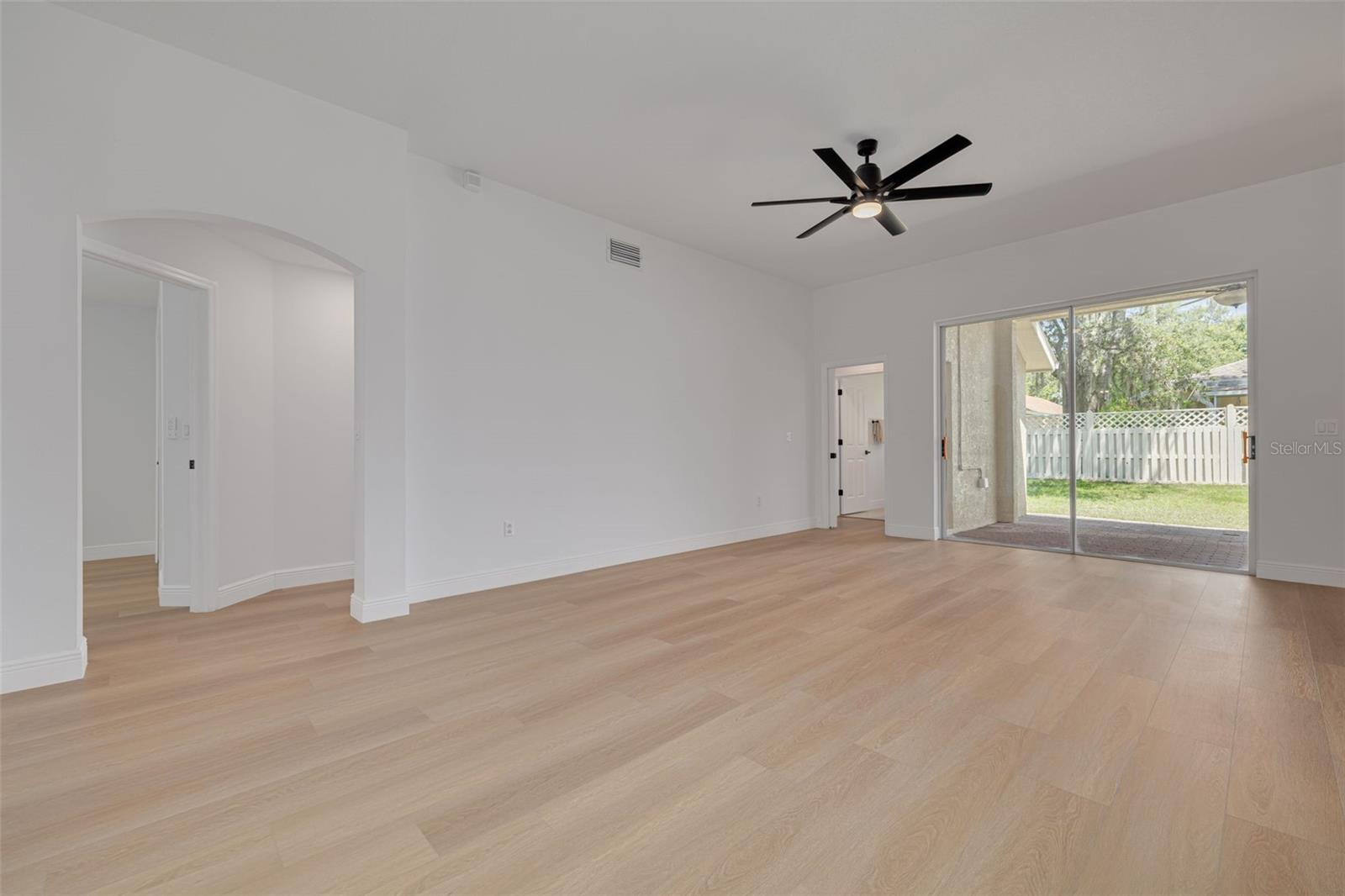 Appreciate the generous proportions and flexible layout of this family space with its clean architectural lines and abundant natural light. The arched doorways and premium flooring showcase the quality renovation throughout this beautiful home.