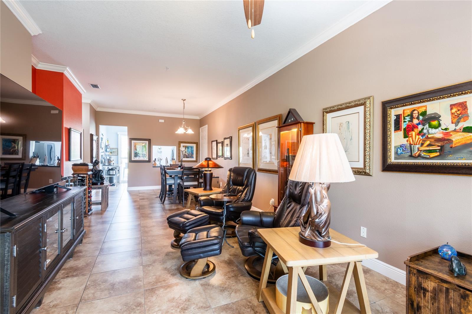 Another view of the living area with dining area in far back.