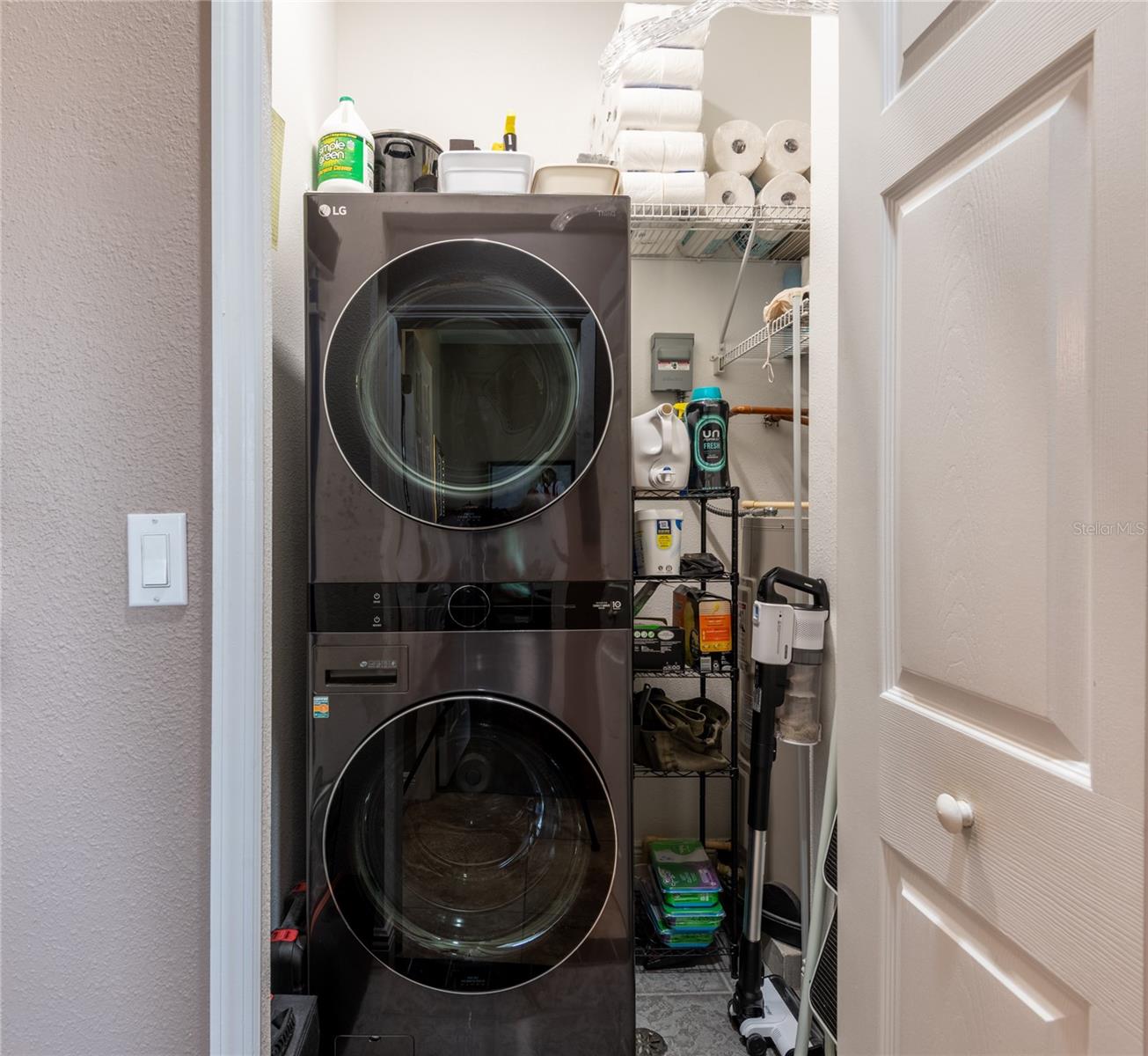 Laundry closet with full size washer/dryer and storage