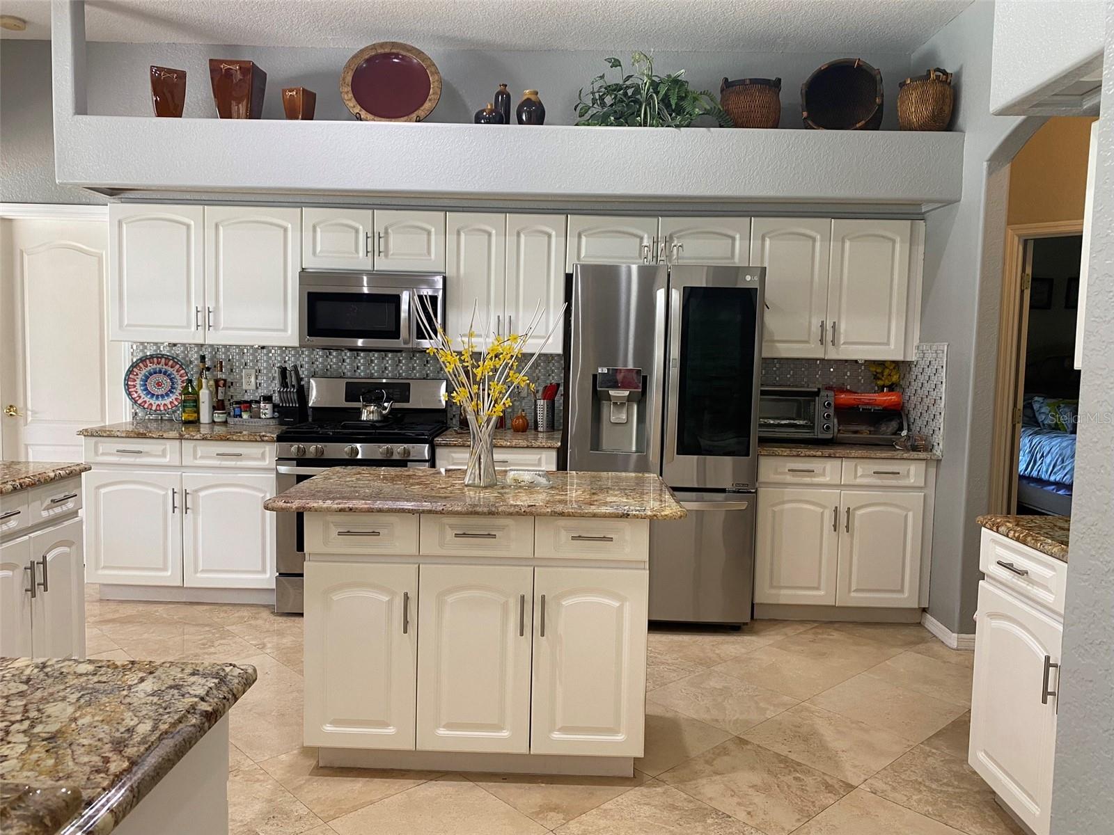 GRANITE COUNTERS AND WHITE CABINETS
