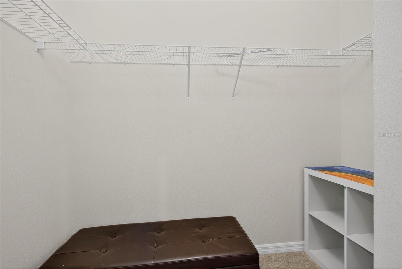 One of two primary bedroom walk-in closets