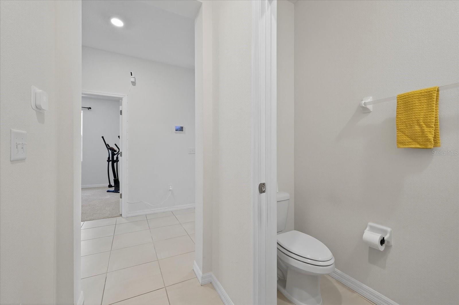 Half bath off entryway hallway