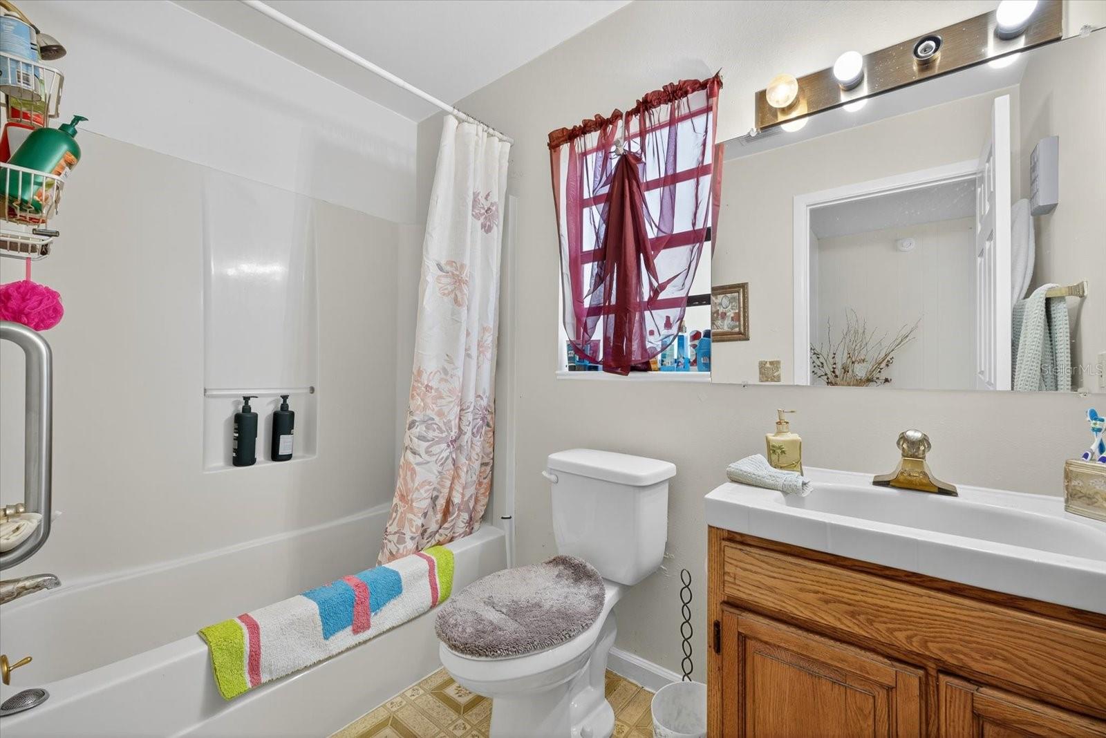 Downstairs Guest Bathroom next to Wash & Dryer
