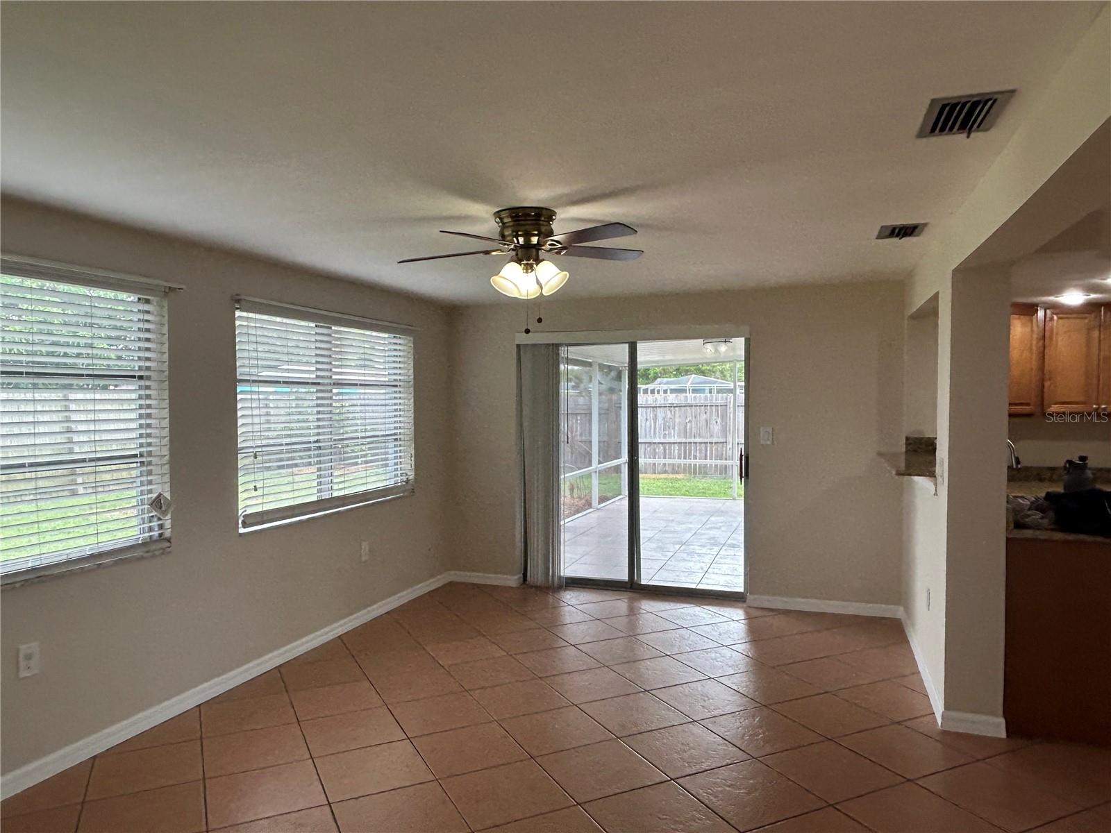 Family room to outside patio, fenced yard