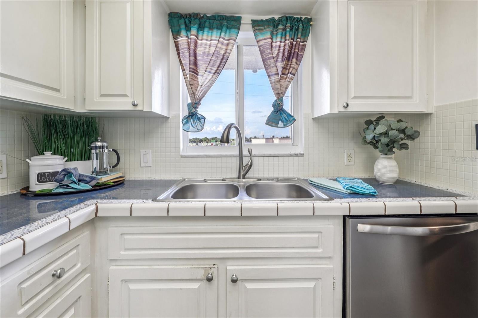 View of the city from kitchen sink