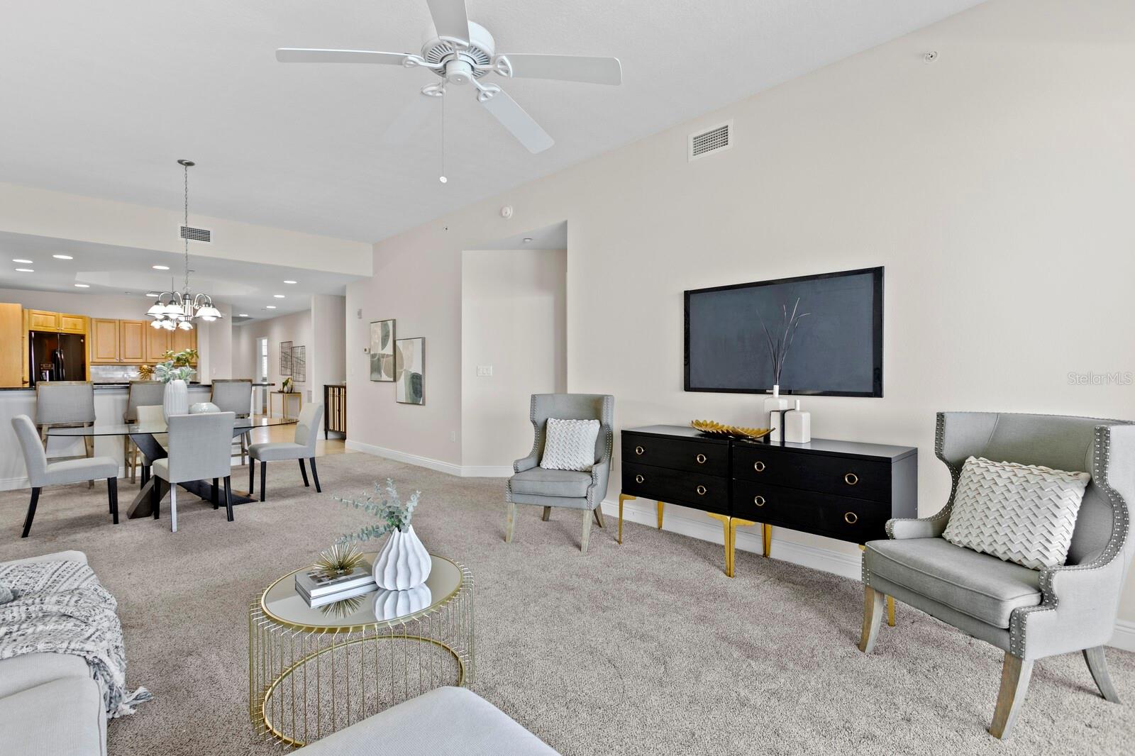 Living room facing dining and kitchen