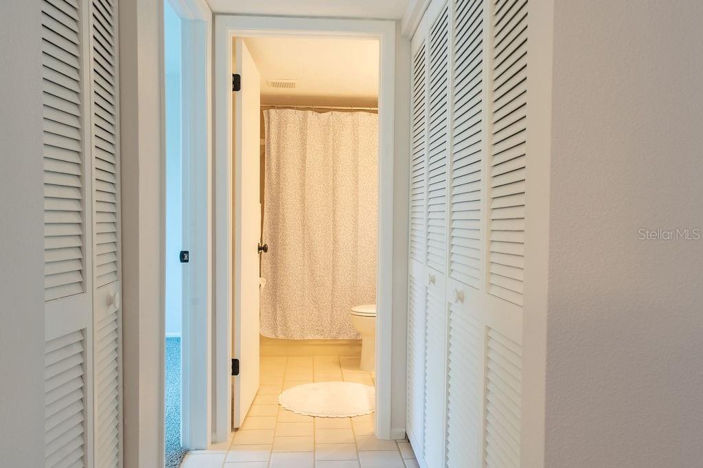 second bedroom with new carpet and hurricane windows