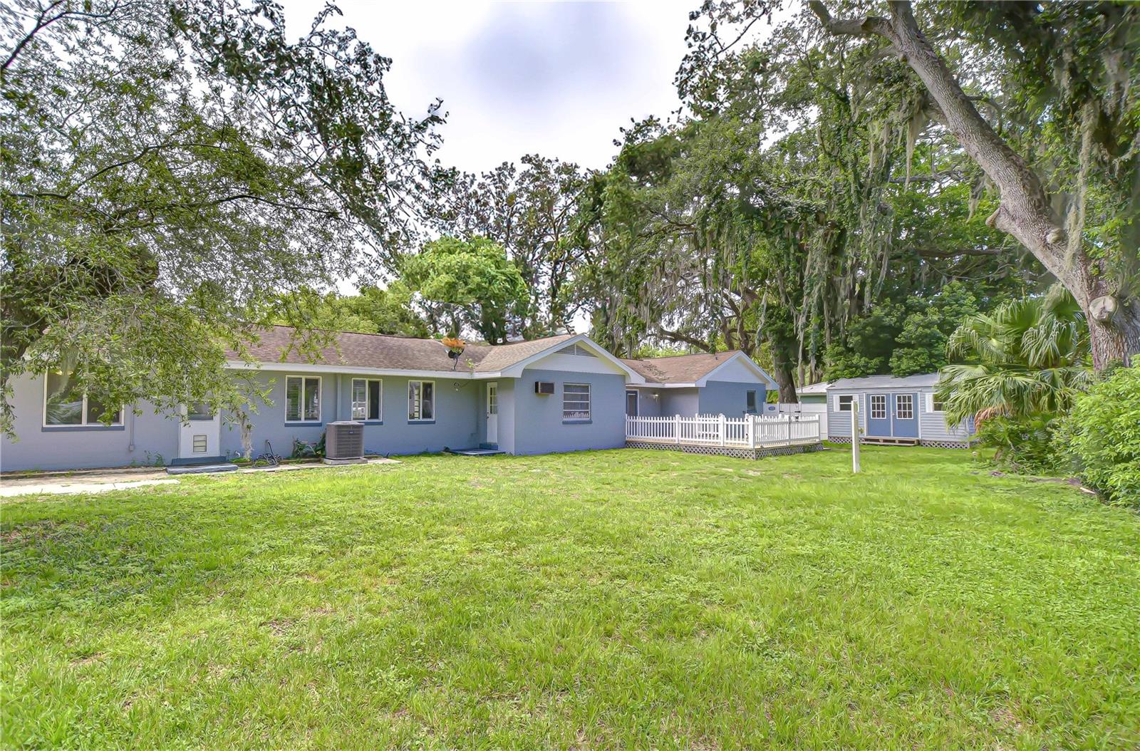 The back yard is large enough for a pool and has 2 sheds with electricity.