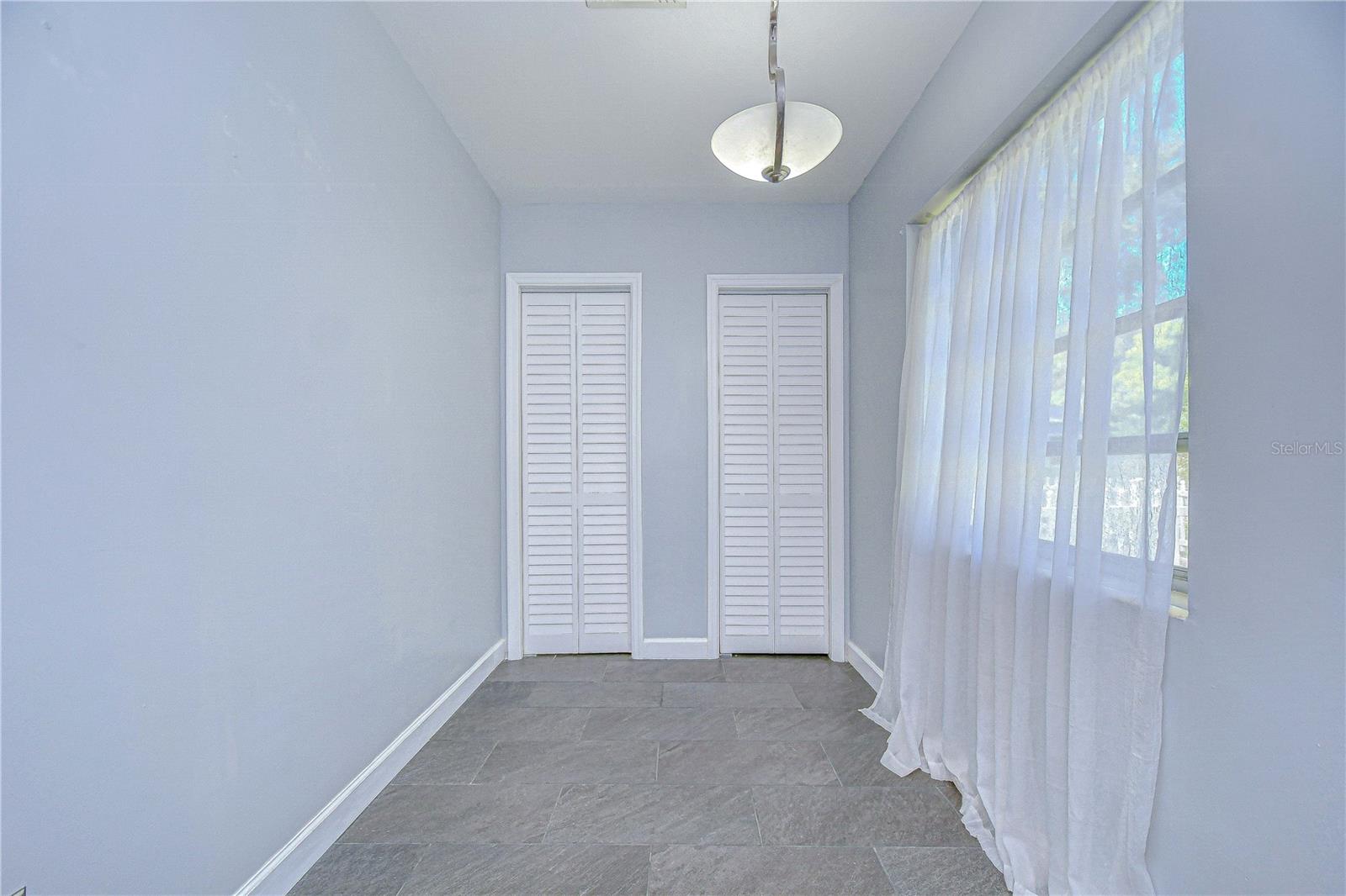 This room is just off the kitchen and would make a great panty, or coffee station!