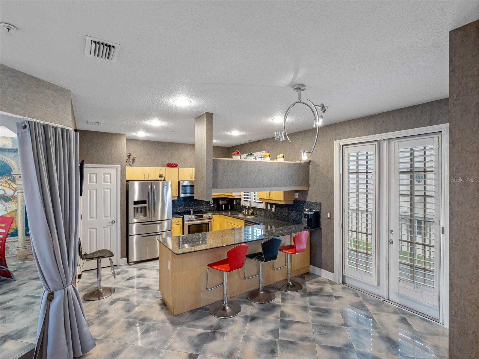 kitchen double door leading to balcony