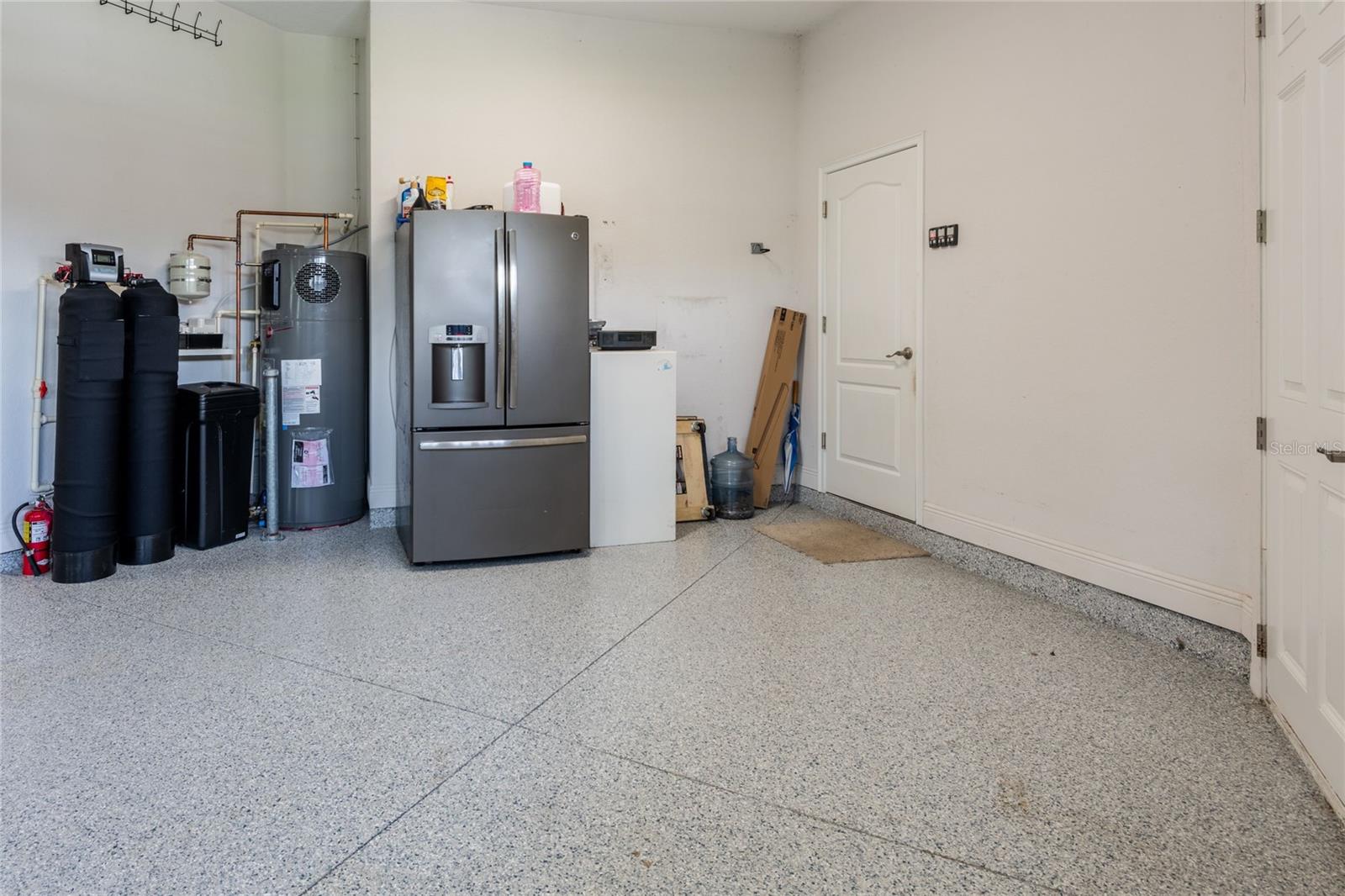 Newer heat pump hot water heater, water softener and epoxy flooring.