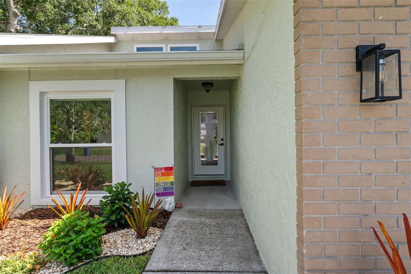 Front door entry to interior foyer